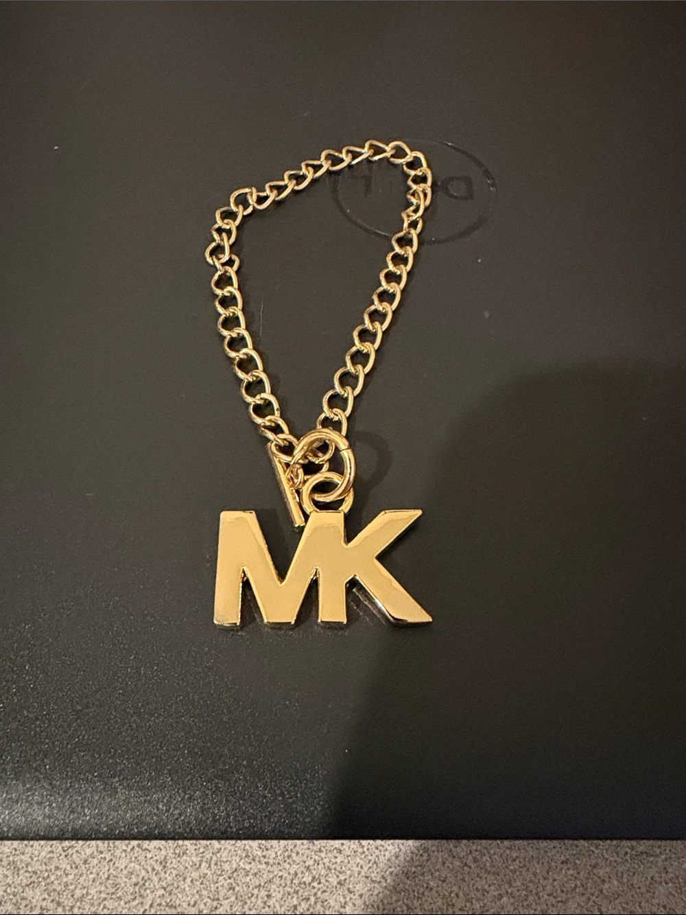 Michael Kors Gold Tone MK Logo Bracelet